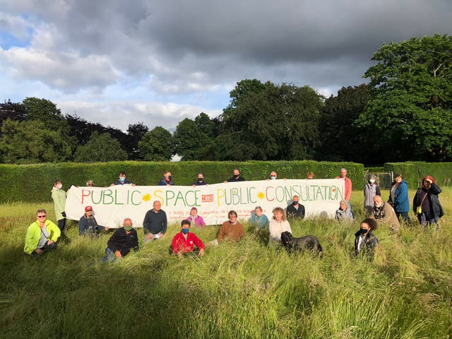 <p>Protesters assemble at the meadow in Heigham Park in July</p>