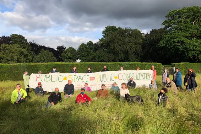 <p>Protesters assemble at the meadow in Heigham Park in July</p>