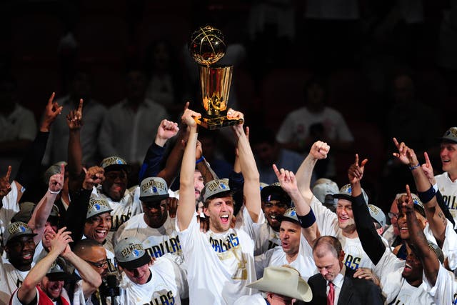 <p>Dirk Nowitzki and his Dallas Mavericks teammates celebrate their 2011 NBA title</p>