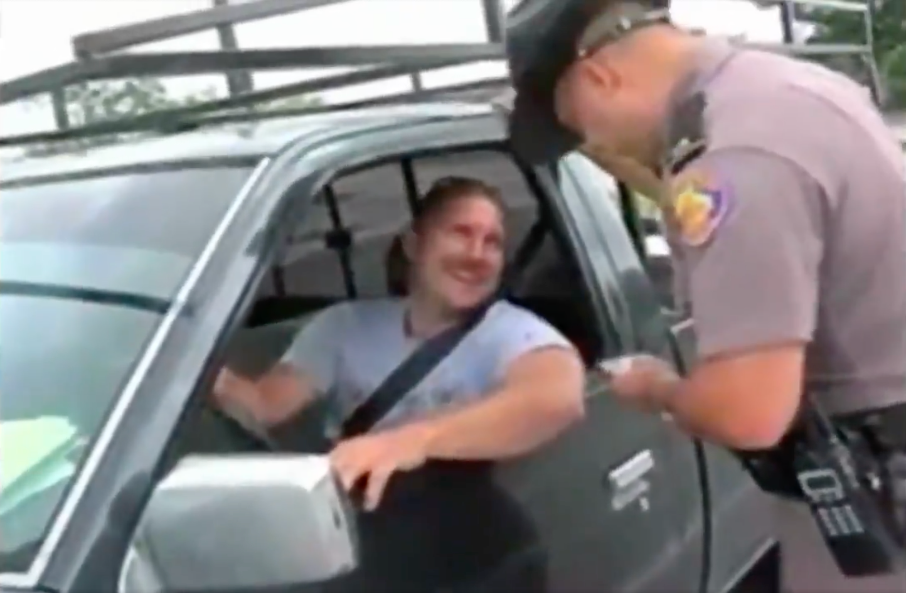 <p>In a 1980s TV news clip, a driver is pulled over for not wearing his seatbelt</p>