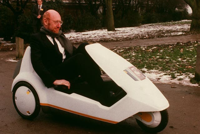 <p>Sir Clive Sinclair demonstrates his battery-assisted pedal powered tricycle on January 10, 1985 in Alexandra Palace, London</p>