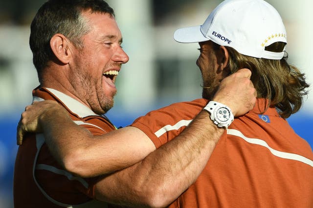 <p>Team Europe vice-captain Lee Westwood celebrates with Tommy Fleetwood in 2018</p>
