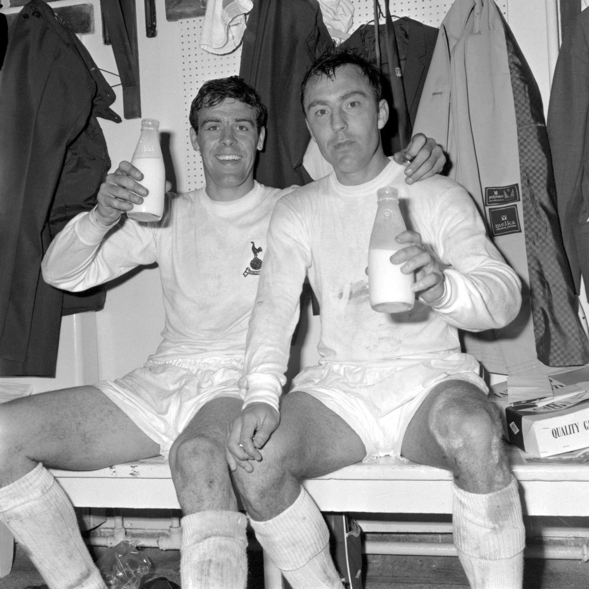 Jimmy Greaves, right, and Mike England celebrate winning the 1967 FA Cup with a pint of milk in the dressing room at Wembley (PA)
