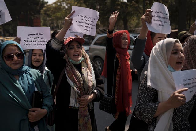 <p>Women march to demand their rights under the Taliban rule during a demonstration near the former Women’s Affairs Ministry in Kabul </p>