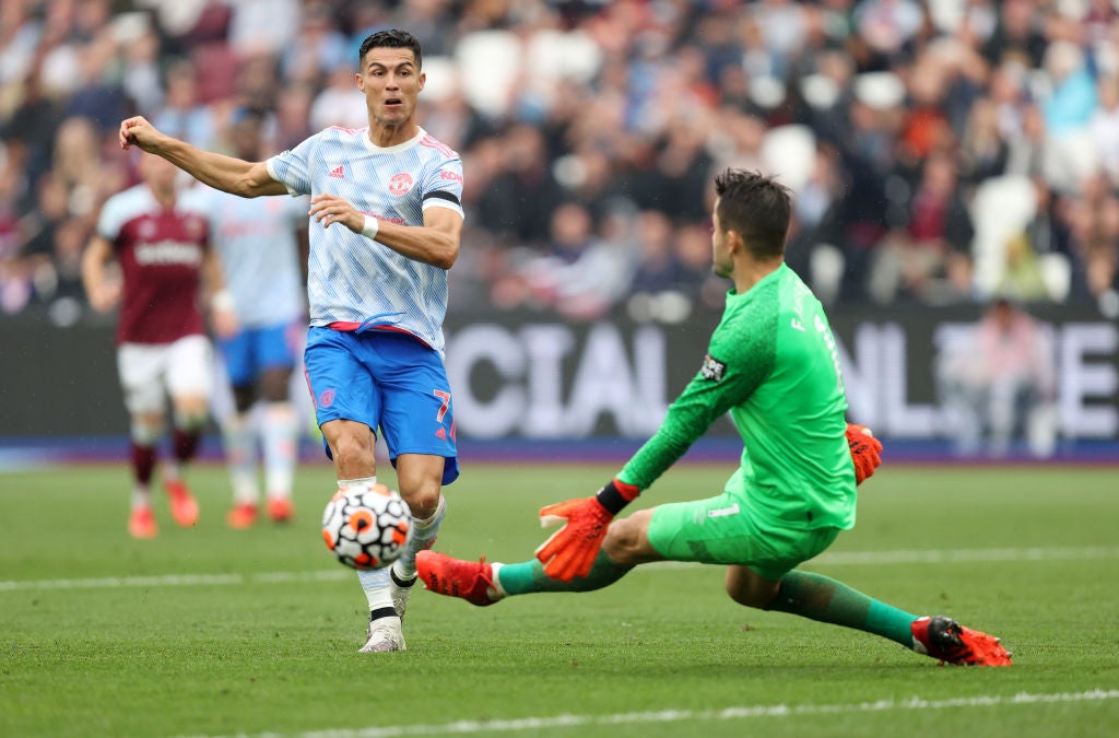 <p>Cristiano Ronaldo sees his shot saved by Lukasz Fabianski </p>