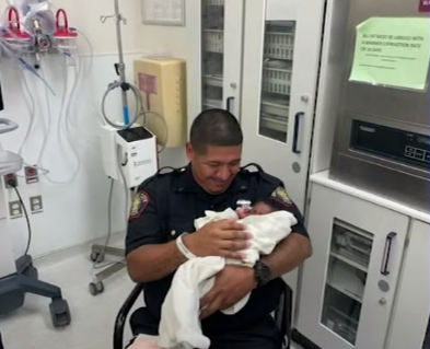 <p>Officer Eduardo Matute caught the one-month-old baby and is being hailed as a hero</p>