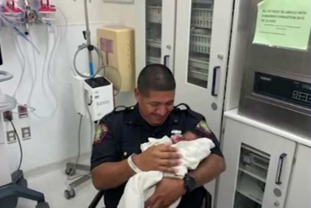 <p>Officer Eduardo Matute caught the one-month-old baby and is being hailed as a hero</p>