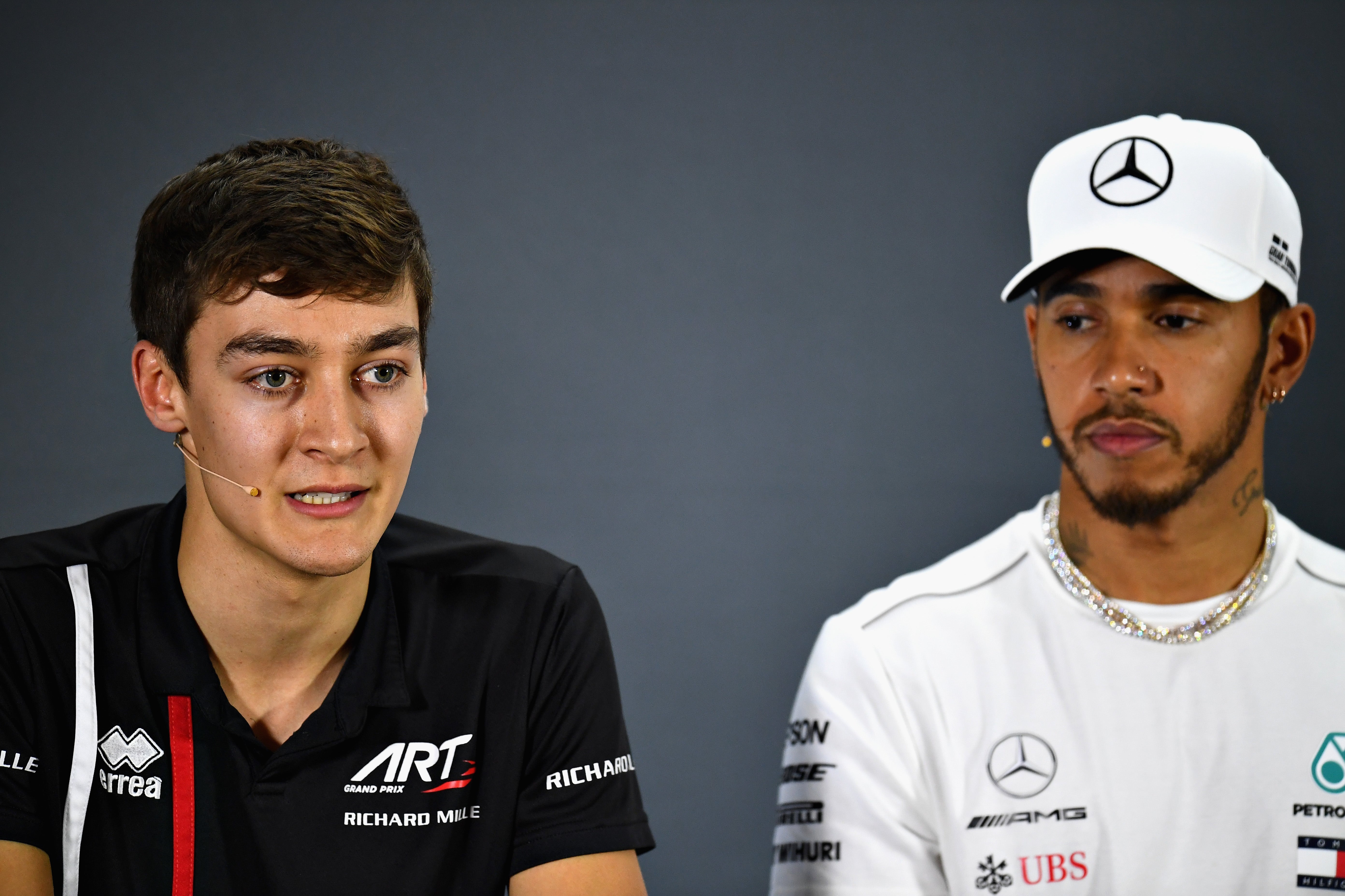 George Russell (left) and Lewis Hamilton will be teammates in 2022