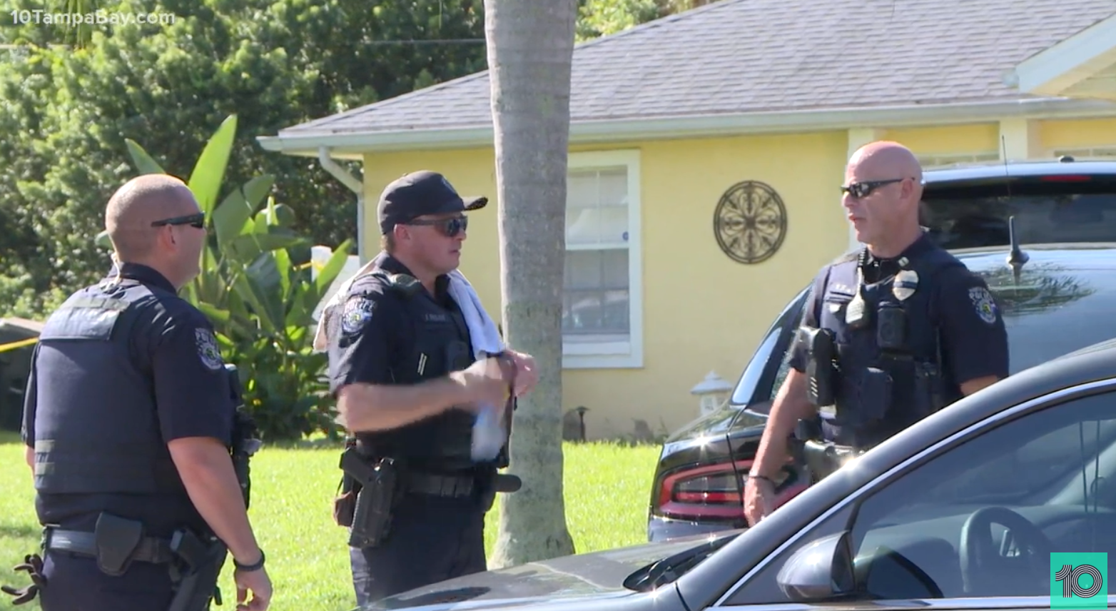 North Port Police officers stand guard outside the Laundrie family home on Monday as FBI agents execute a search warrant