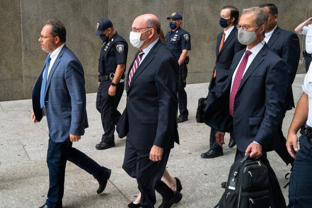 <p>The Trump Organization's Chief Financial Officer Allen Weisselberg, center, leaves after a courtroom appearance in New York, Monday, Sept. 20, 2021</p>