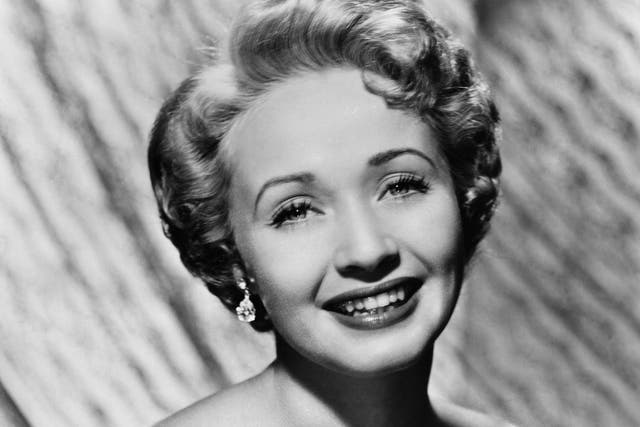 <p>The blue-eyed, blonde and petite Powell was the coloratura ingenue of frothy romances and Technicolor musicals</p>