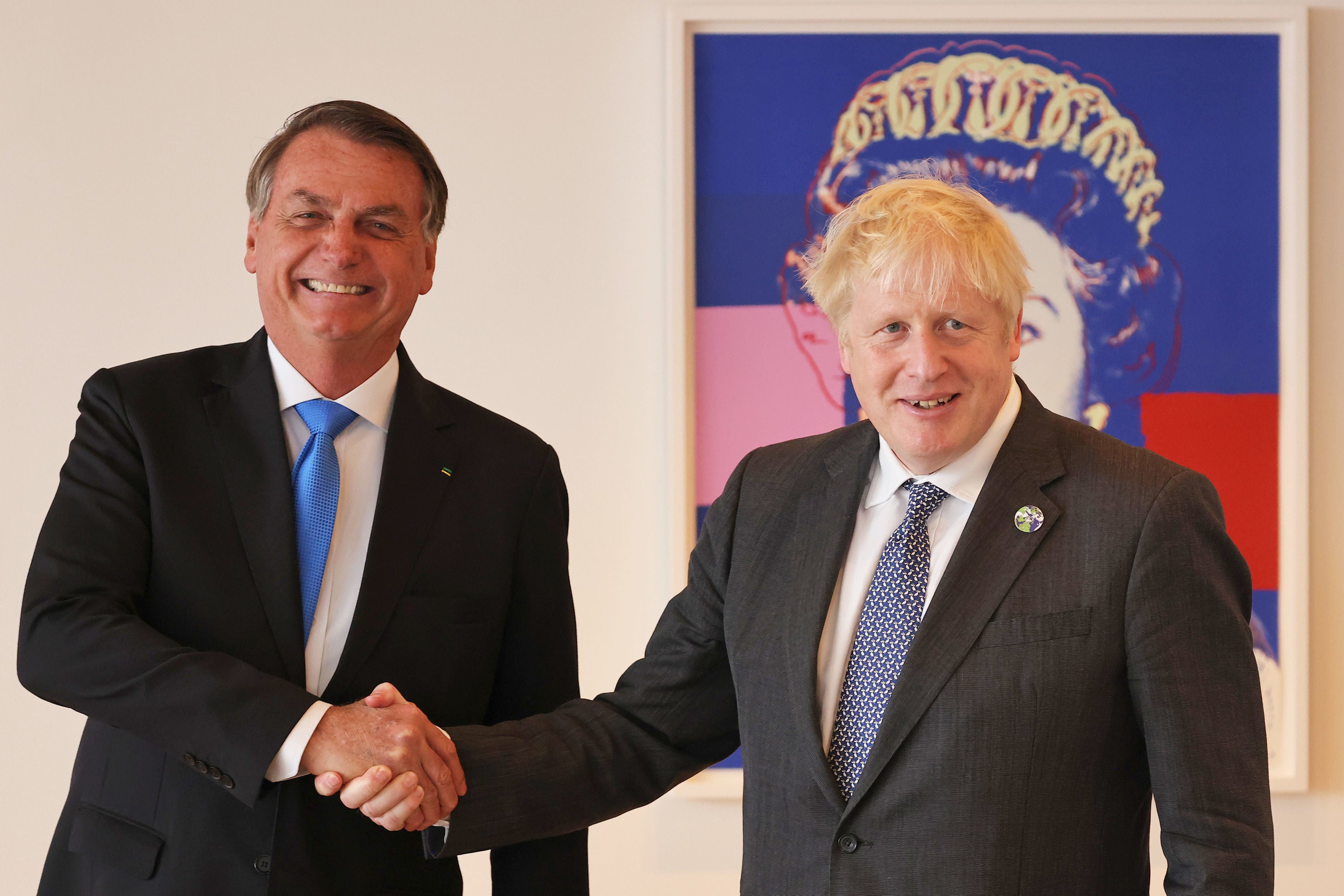 Boris Johnson shakes hands with Brazil’s president Jair Bolsonaro ahead of a bilateral meeting at the UK diplomatic residence in New York