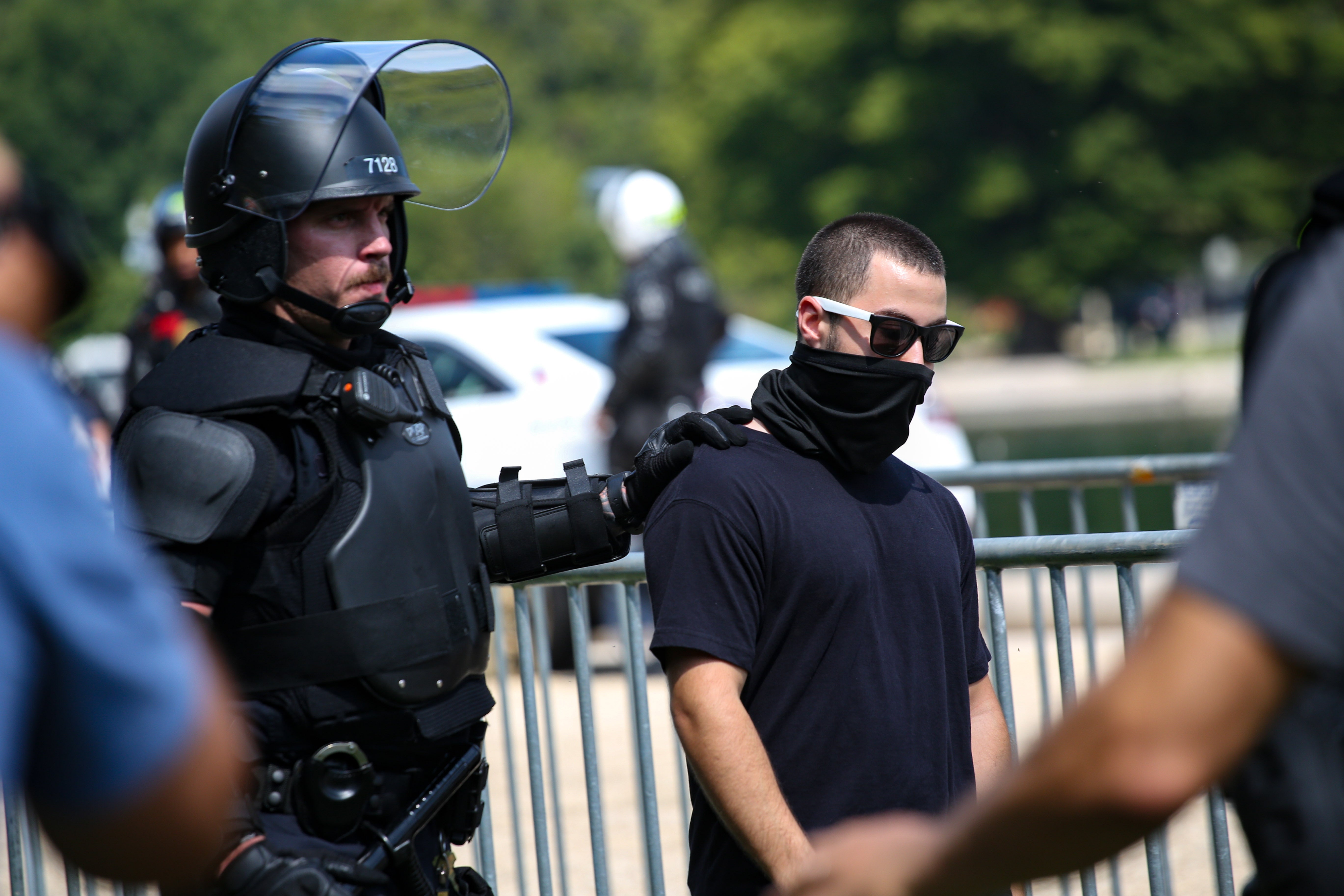 <p>Riot police make a targeted arrest at the "Justice for J6"</p>
