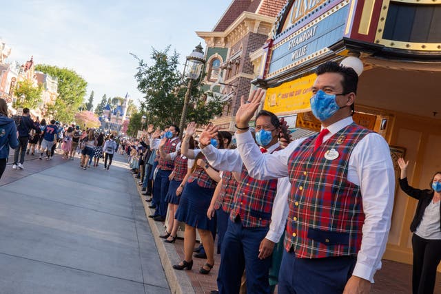 <p>In this handout photo provided by Disneyland Resort,  Guests as are waved to by workers as they take in the sights and sounds of Main Street USA at the Disneyland Resort </p>