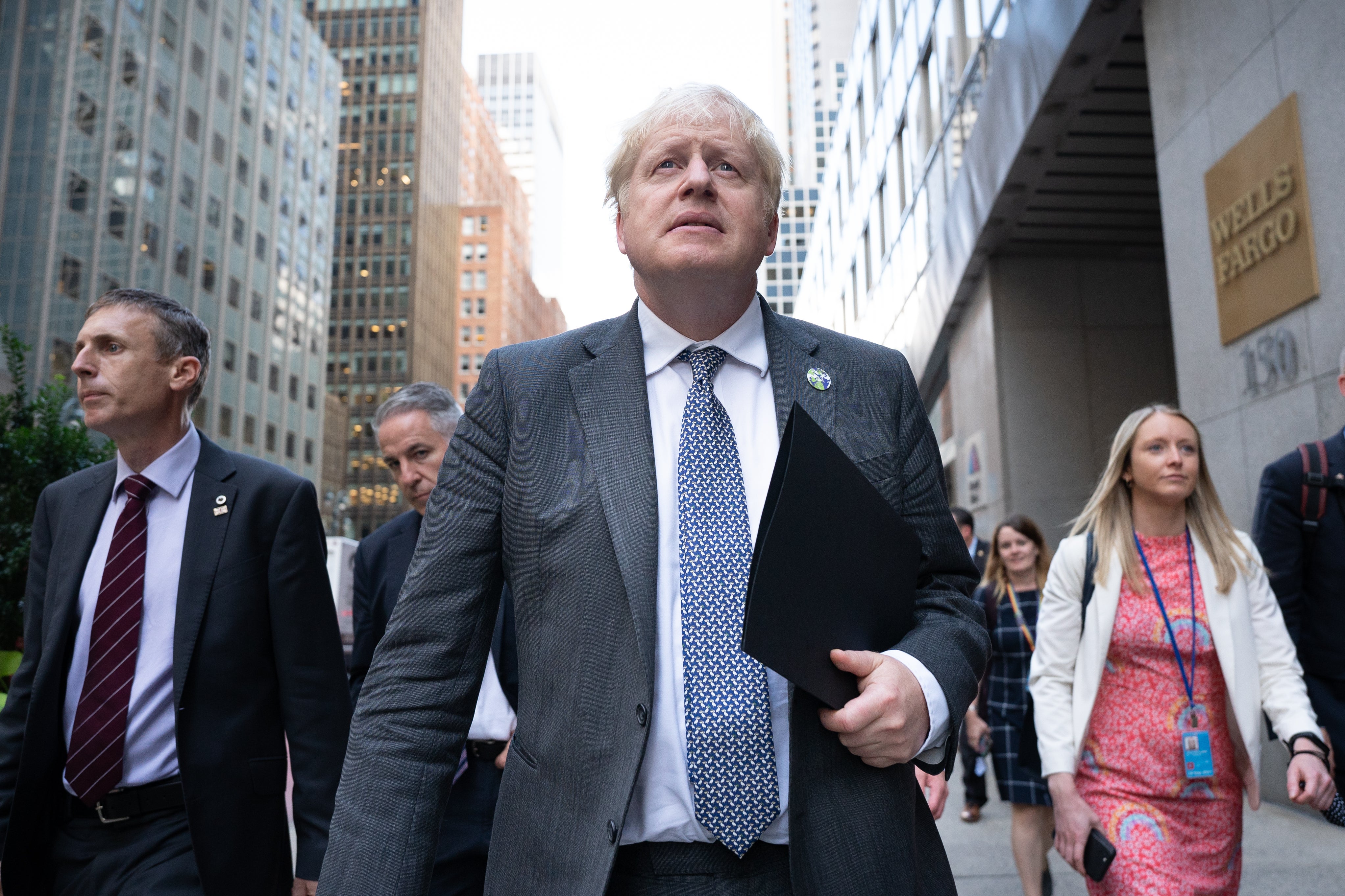 Boris Johnson walks to a television interview in New York on Tuesday