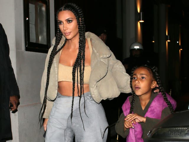 <p>North West and Kim Kardashian (L)</p>