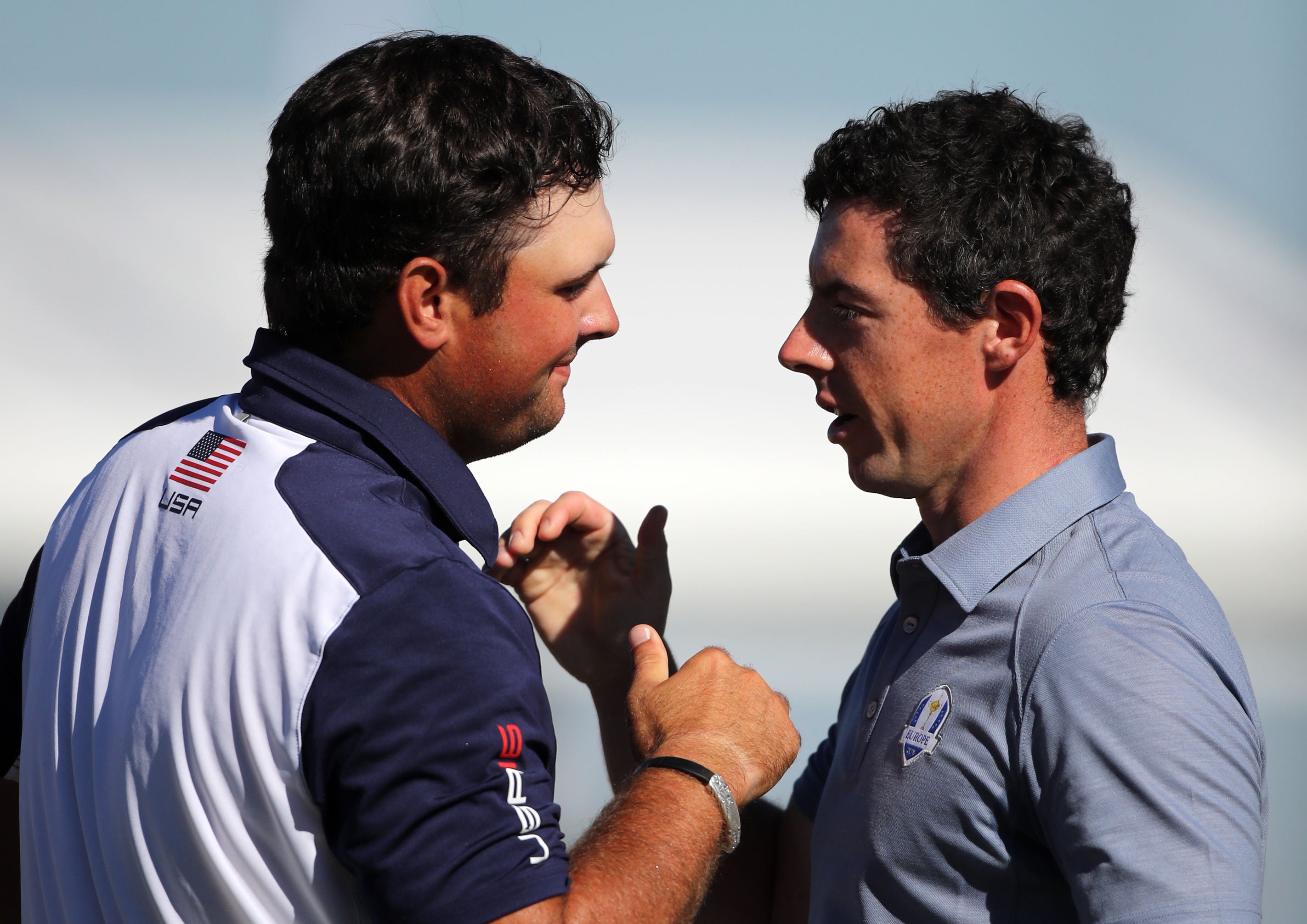 Patrick Reed and Rory McIlroy shake hands after their singles match at Hazeltine (Peter Byrne/PA)