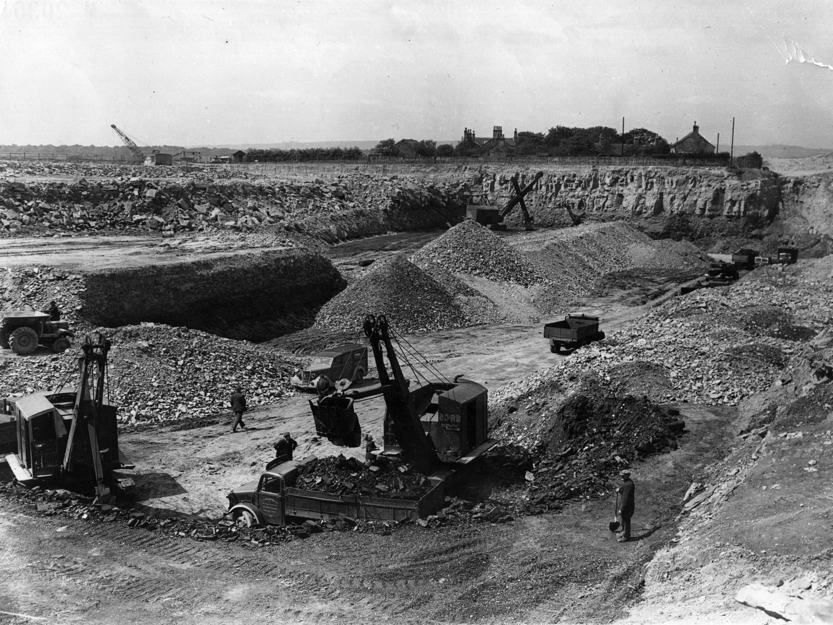 Mechanical shovels work the open cast coal mine at Templenewsam, near Leeds