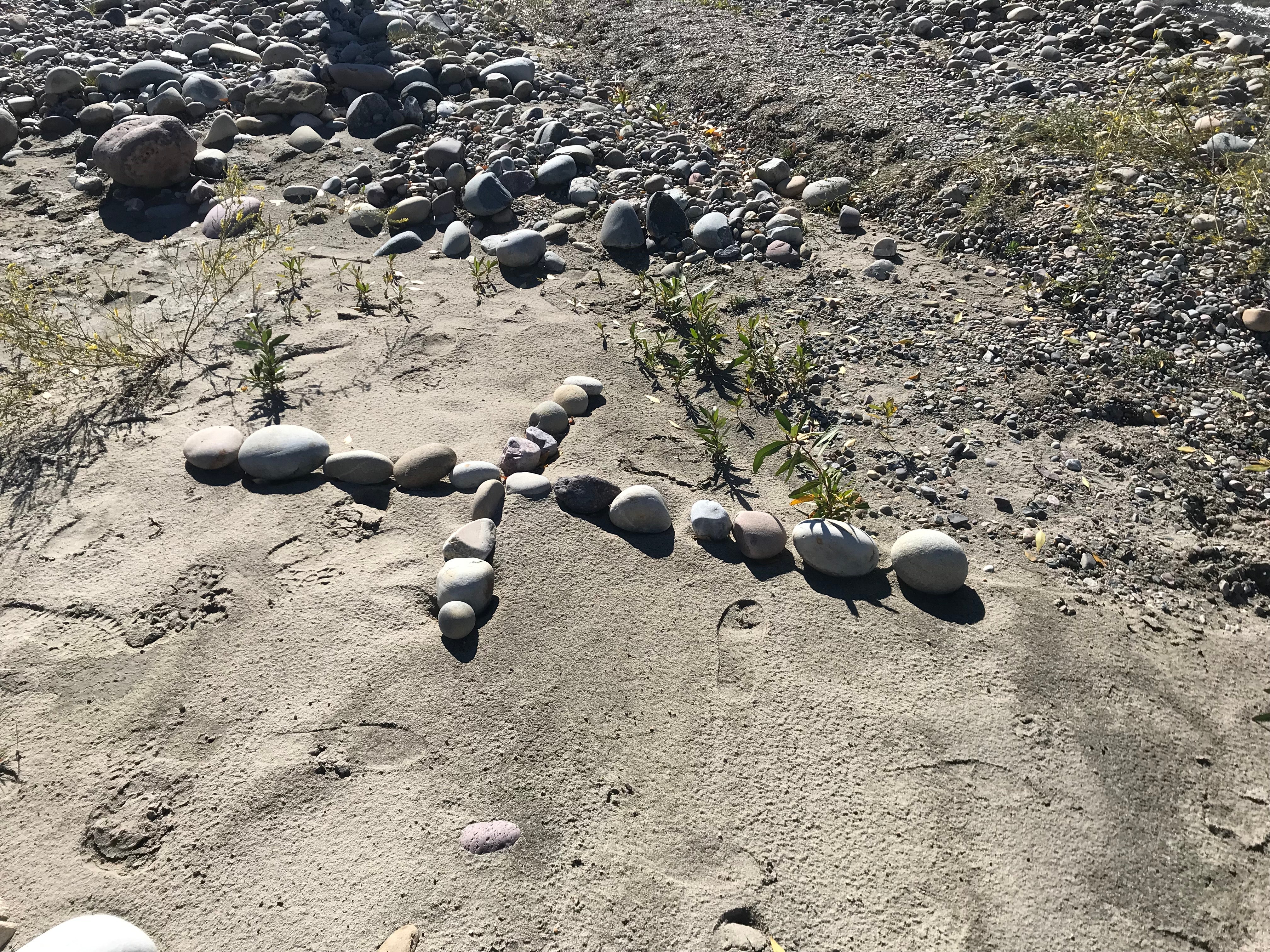 A cross laid by Jim Schmidt at the site where Ms Petito was found