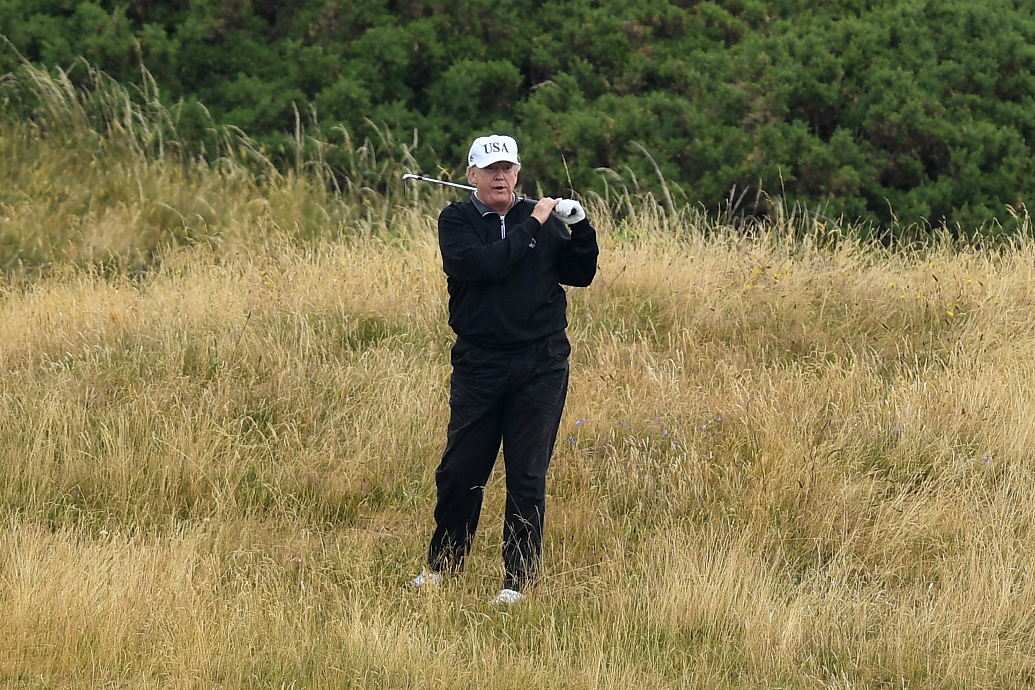 Donald Trump plays a round of golf at Trump Turnberry Luxury Collection Resort during the US President's first official visit to the United Kingdom on July 15, 2018 in Turnberry, Scotland.
