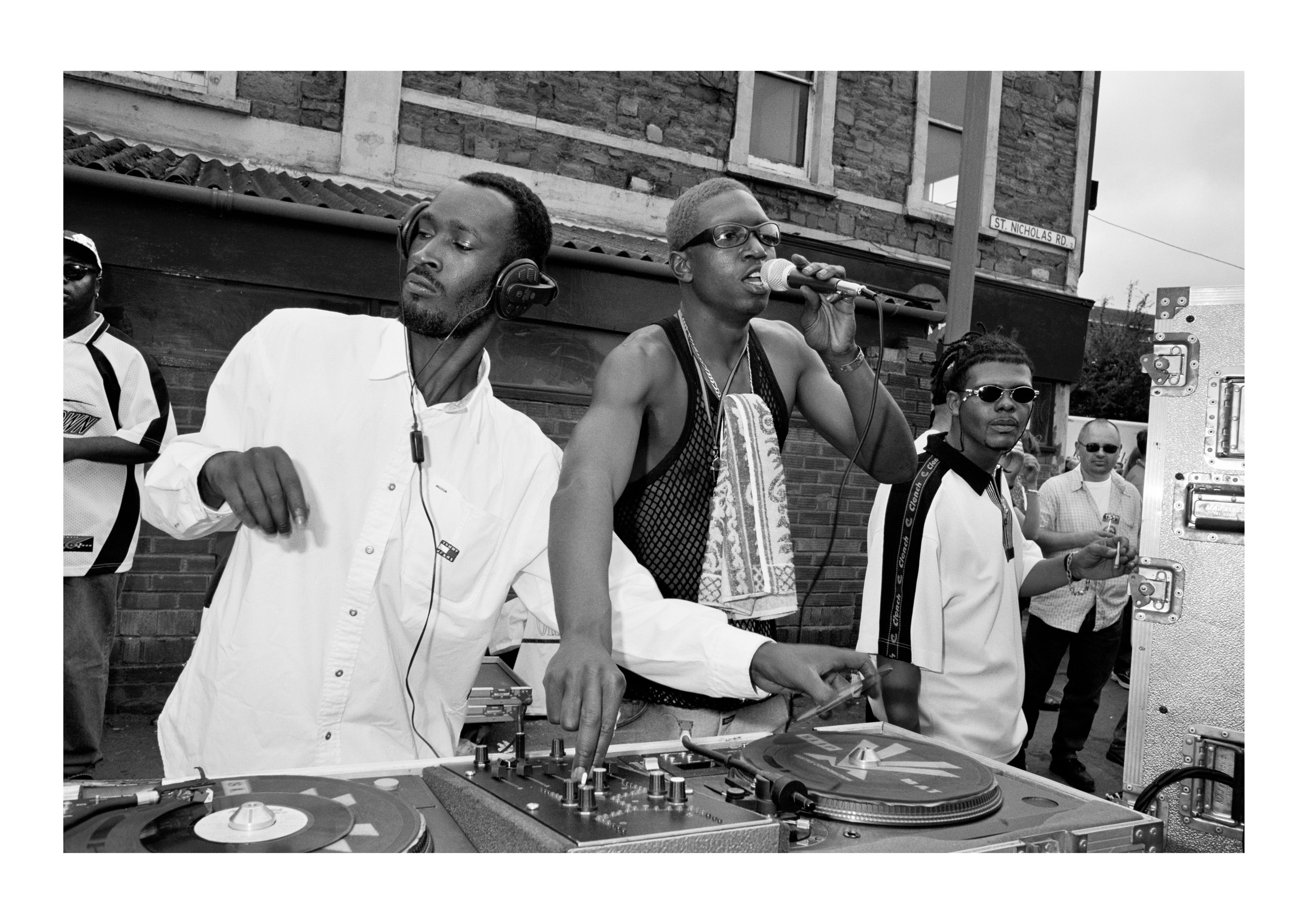 Sound system outside the former Crystal Dove Blues Club, St Paul’s Carnival, July 1998. Carnival is a special time for Bristolians: the streets are theirs for the day. At the time this picture was taken, Banksy was spraying a mural around the back of the building. Both building and mural are now gone