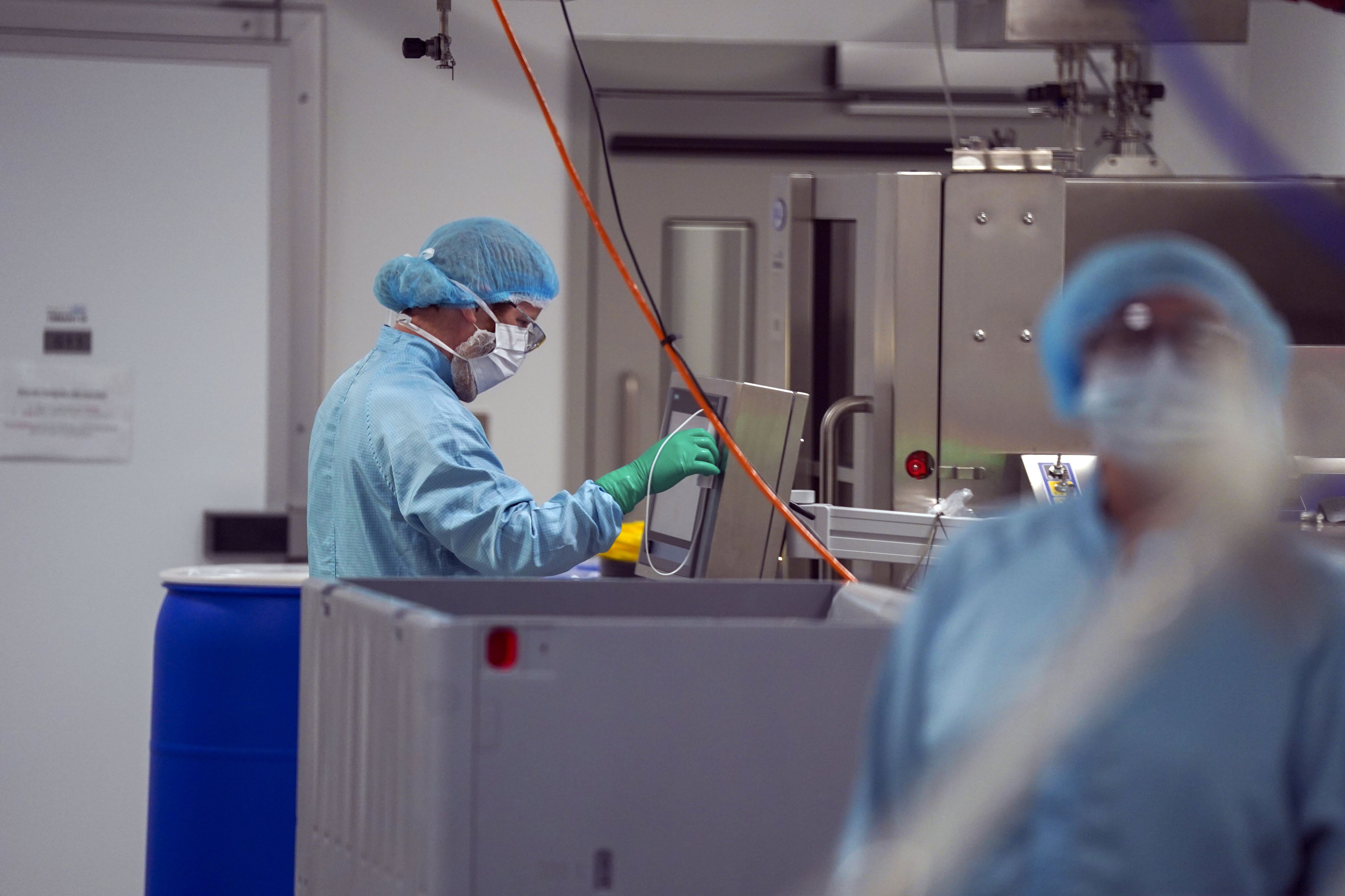 Staff work in a laboratory at Oxbox Biomedica (Steve Parsons/PA)