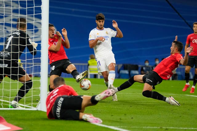 Marco Asensio scored a hat-trick for Real Madrid in their 6-1 win over Mallorca (Manu Fernandez/AP/PA)