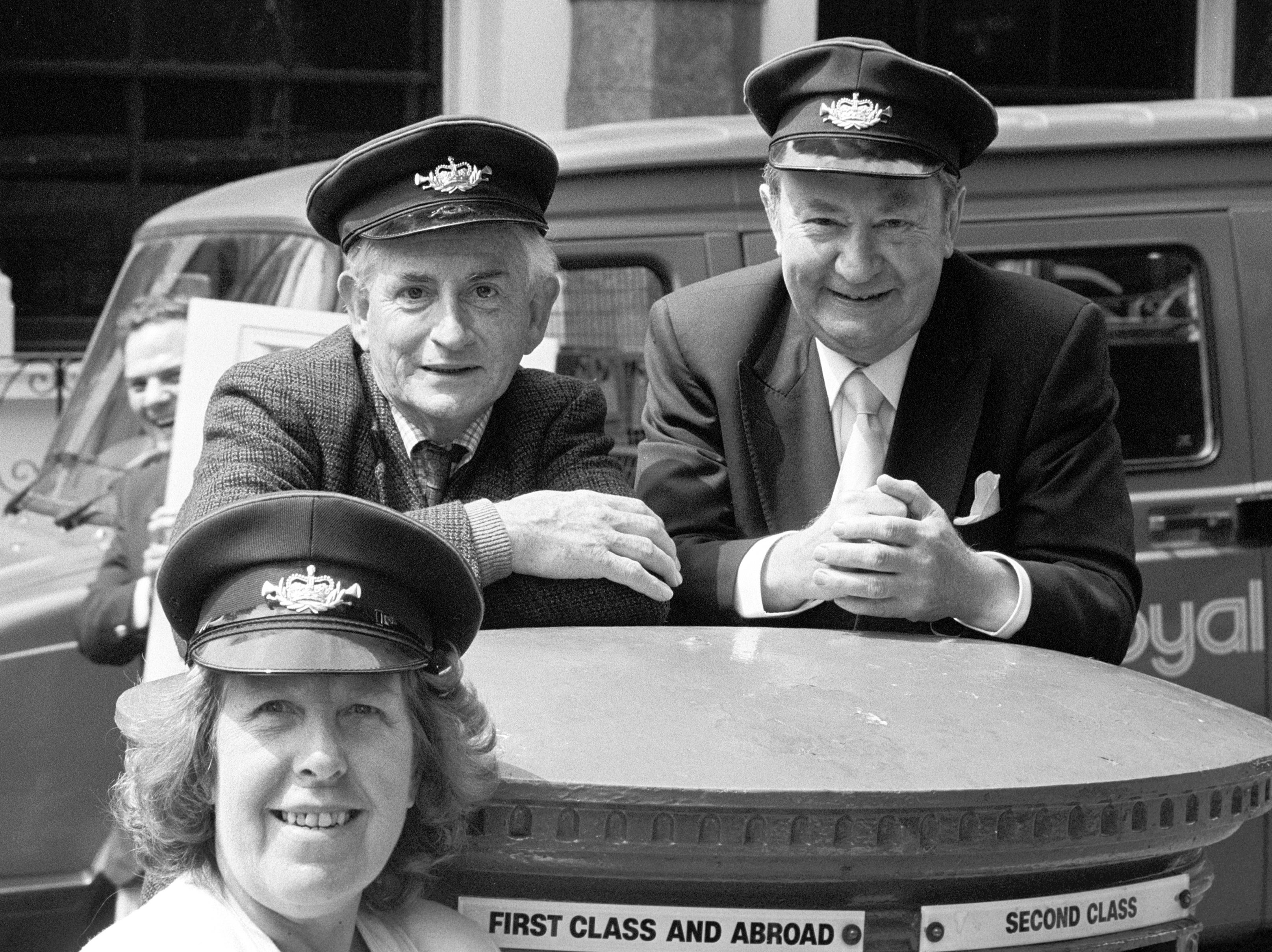 BBC stars Robert Fyfe (left), Peter Sallis (right) and Kathy Staff appearing in London to promote the launch of a Royal Mail guide to its postbus network in 1989