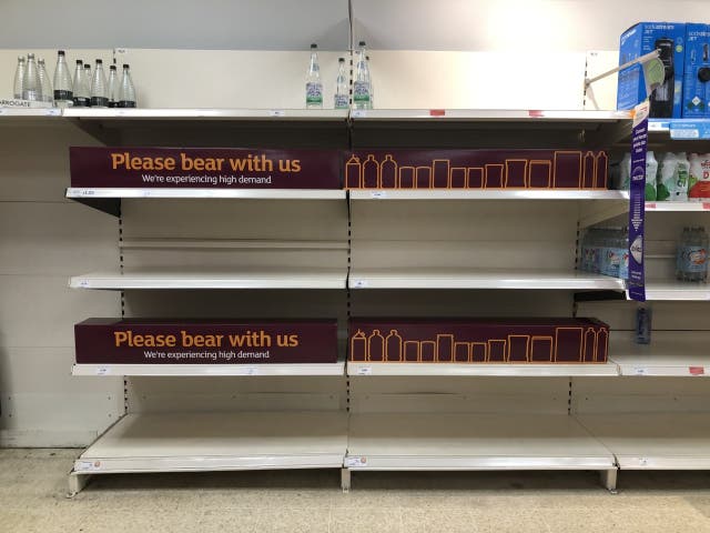 Empty shelves and signs on the soft drinks aisle of a Sainsbury’s store in Blackheath, Rowley Regis in the West Midlands.
