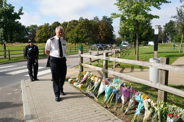 <p>Chief Superintendent Trevor Lawry by the floral tributes near where the body of Sabina Nessa was found</p>