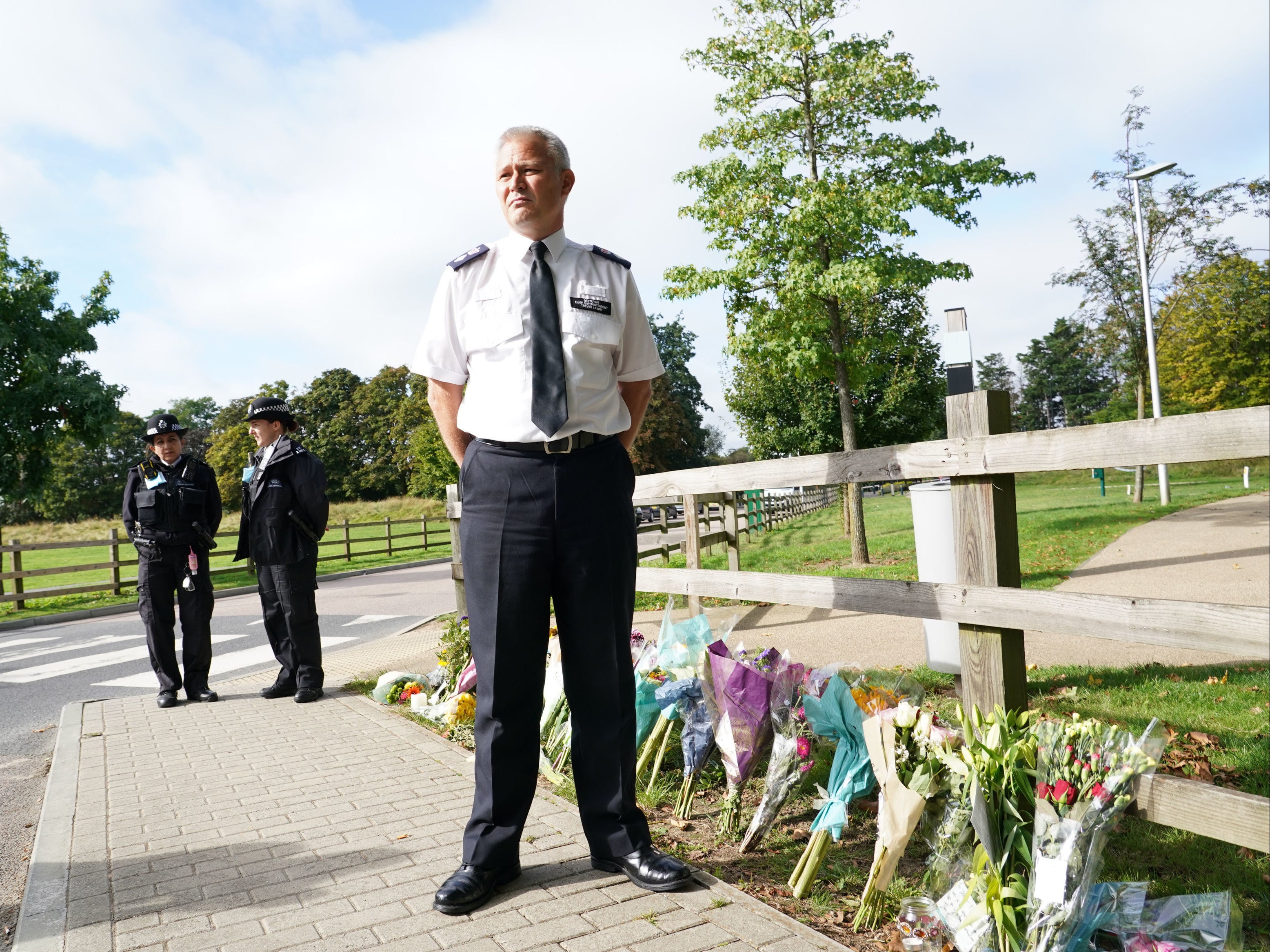 Chief Superintendent Trevor Lawry beside floral tributes to Sabina Nessa