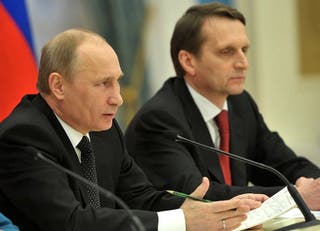 Russian President Vladimir Putin previously seen with his foreign intelligence chief Sergei Naryshkin