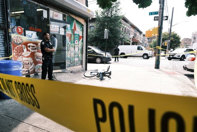 <p>Police converge on the scene of a shooting in Brooklyn, one of numerous during the day, on July 14, 2021 in New York City</p>