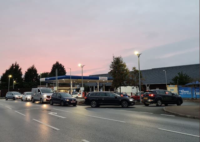 <p>Queueing drivers were filling up cans as well as their tanks at this Tesco petrol station in Allerton Road, South Liverpool on Thursday </p>