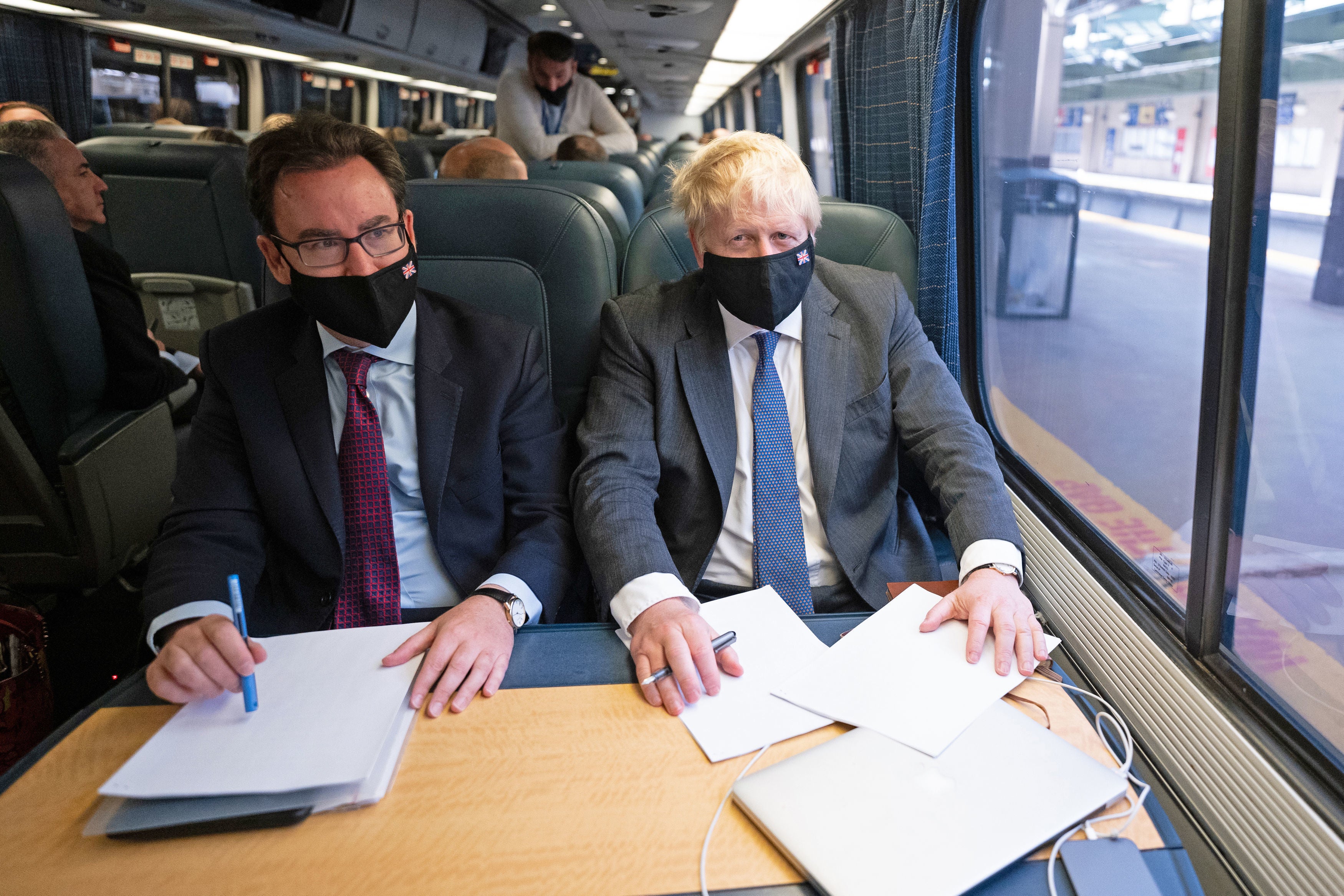 Prime Minister Boris Johnson spoke to reporters about Universal Credit while travelling on a train in the US (Stefan Rousseau/PA)