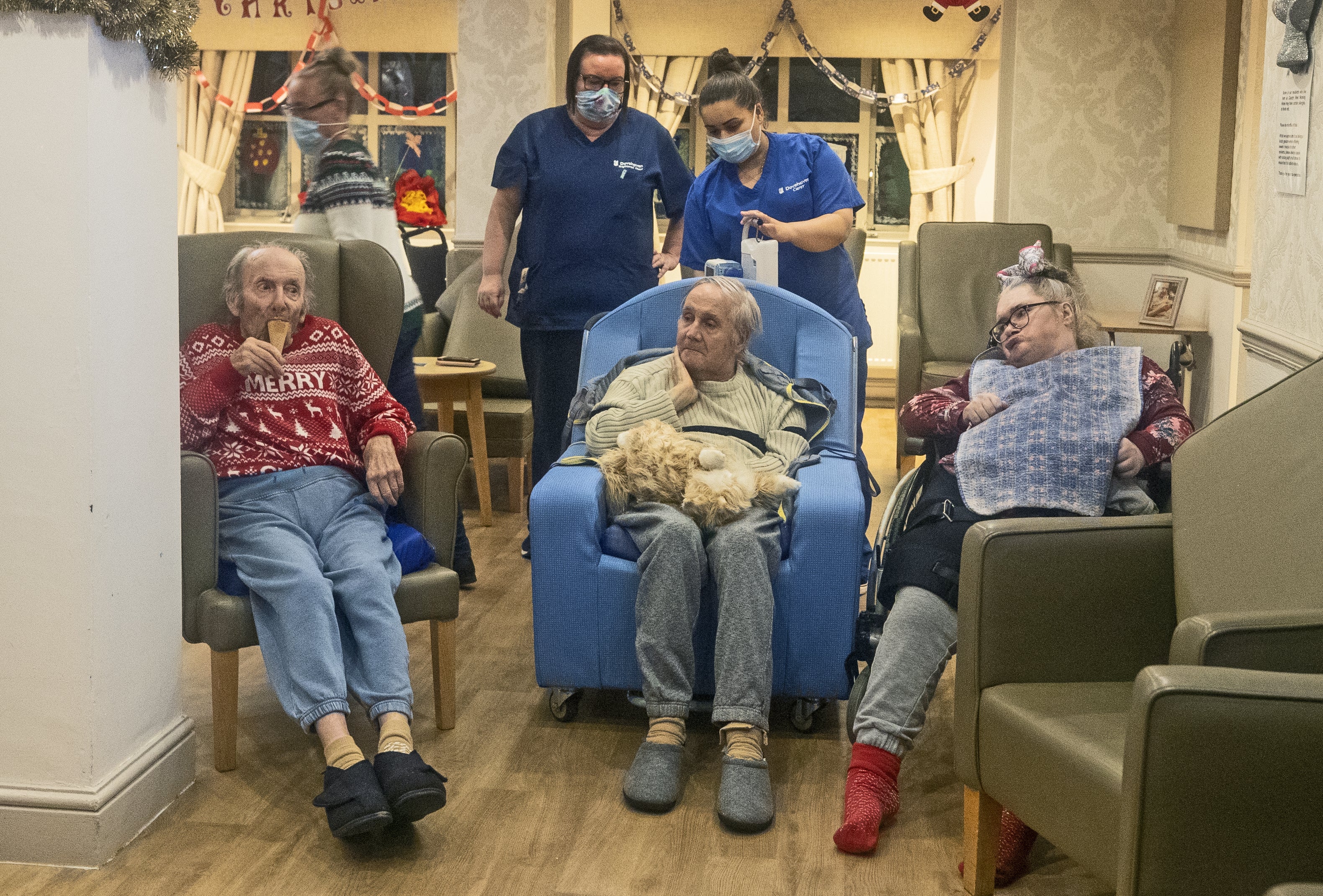 Residents and care workers at Churchview Nursing Home in Liverpool watch a video of last year's christmas lights switch on in Liverpool city centre.