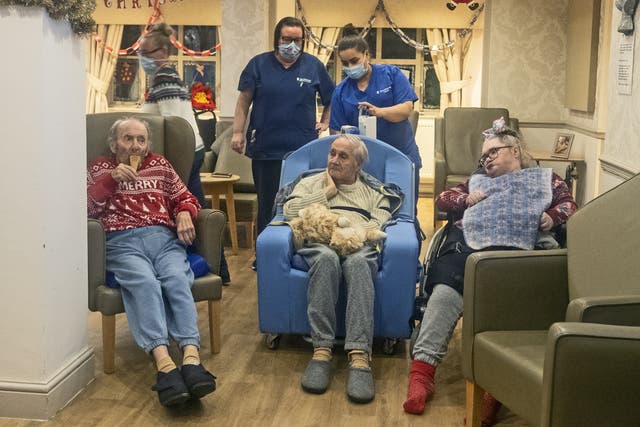 <p>Residents and care workers at Churchview Nursing Home in Liverpool watch a video of last year's christmas lights switch on in Liverpool city centre. </p>