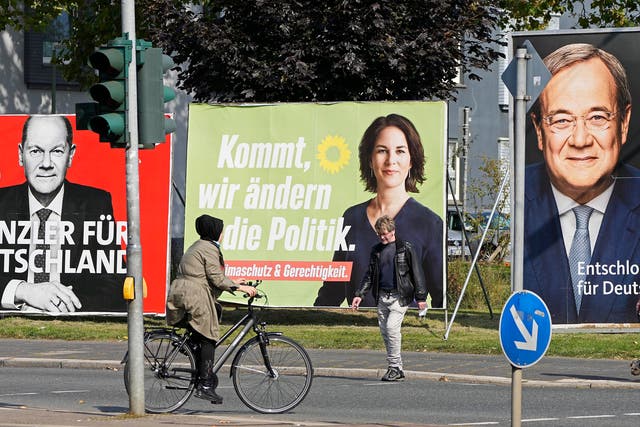 <p>Election posters for the three chancellor candidates, from right, the CDU’s Armin Laschet, the Greens’ Annalena Baerbock and the SPD’s Olaf Scholz, in Gelsenkirchen</p>