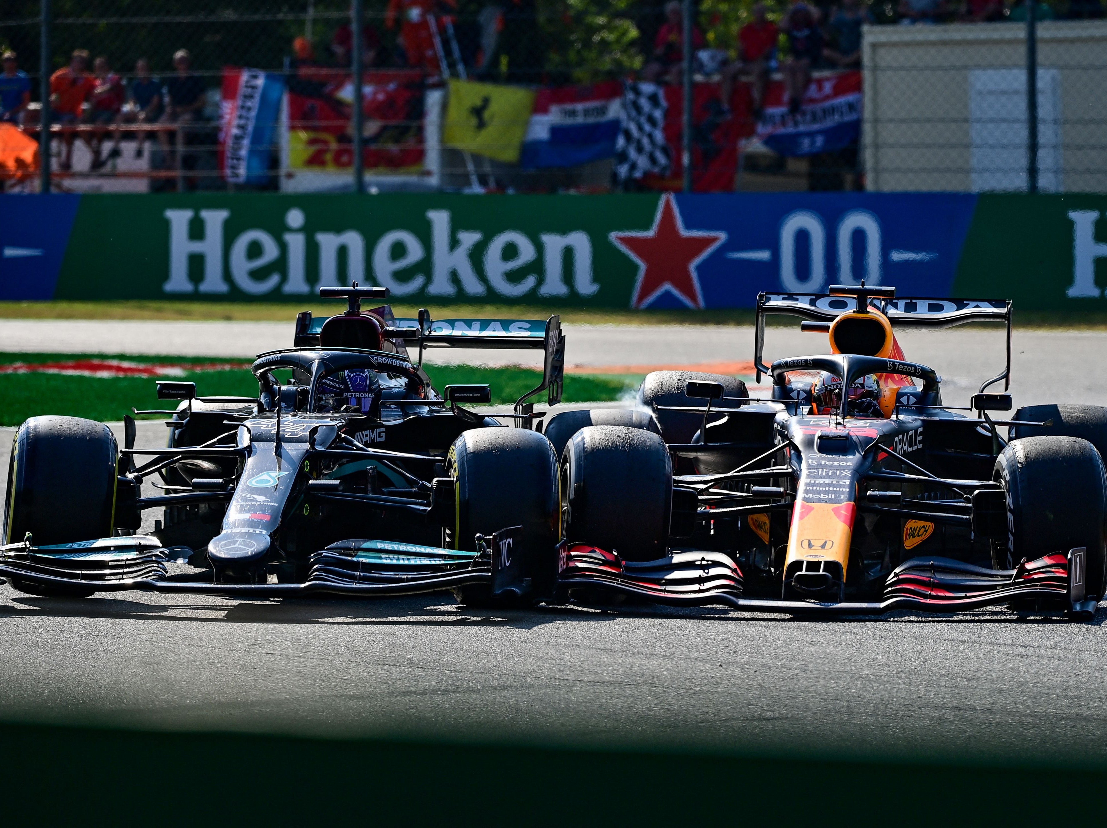 Lewis Hamilton (left) and Max Verstappen crash at the Italian GP