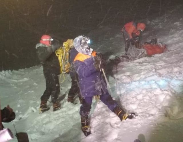 <p>Rescuers on Mount Elbrus after a group of climbers was struck by severe weather conditions while at an altitude of over 16,000ft </p>