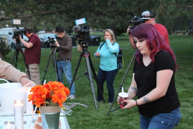 <p>Salt Lake City resident Serena Chavez lights a candle at the vigil she organized honoring Gabby Petito on Wednesday, Sept. 22.</p>
