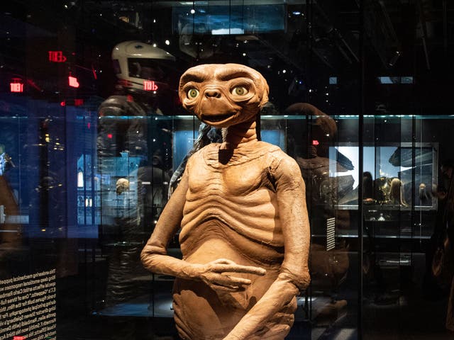 <p>Artefacts of cinema, from such films as ‘ET’ and ‘Star Wars’ are displayed inside the Academy Museum Of Motion Pictures</p>