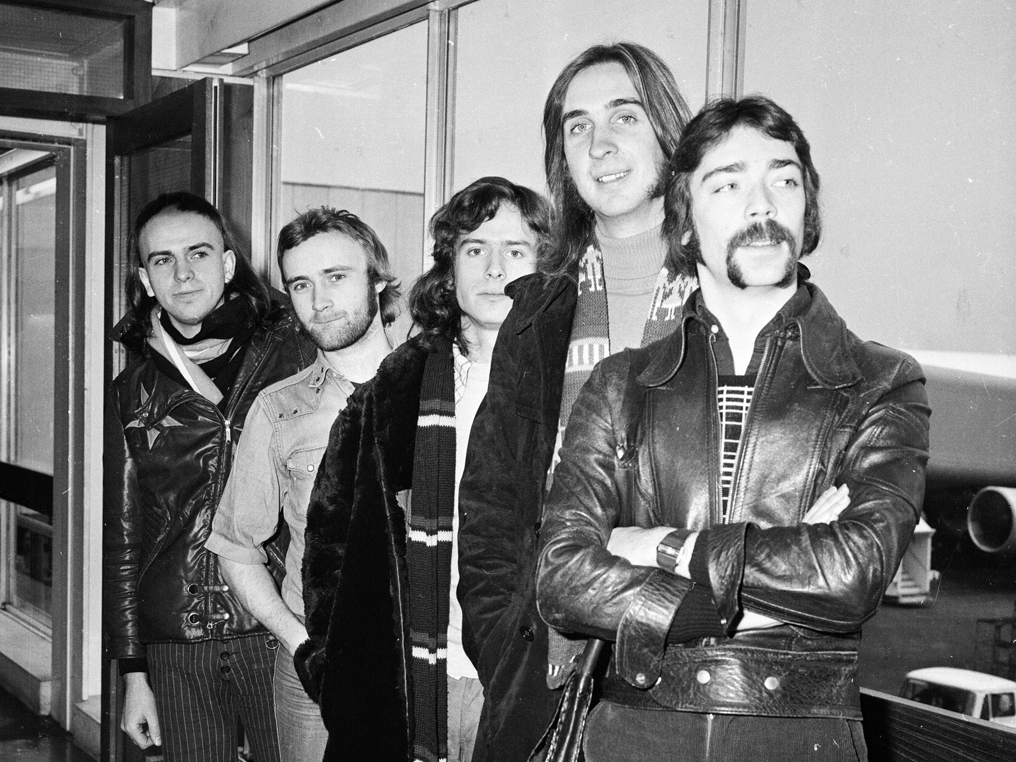 Genesis pose for a snap at London Airport in 1974