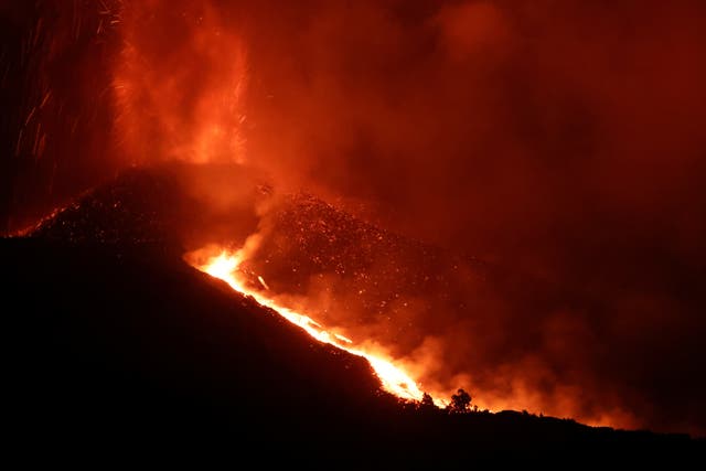 <p>Fire and smoke rise from the volcano on the Canary Island of La Palma on Friday night </p>