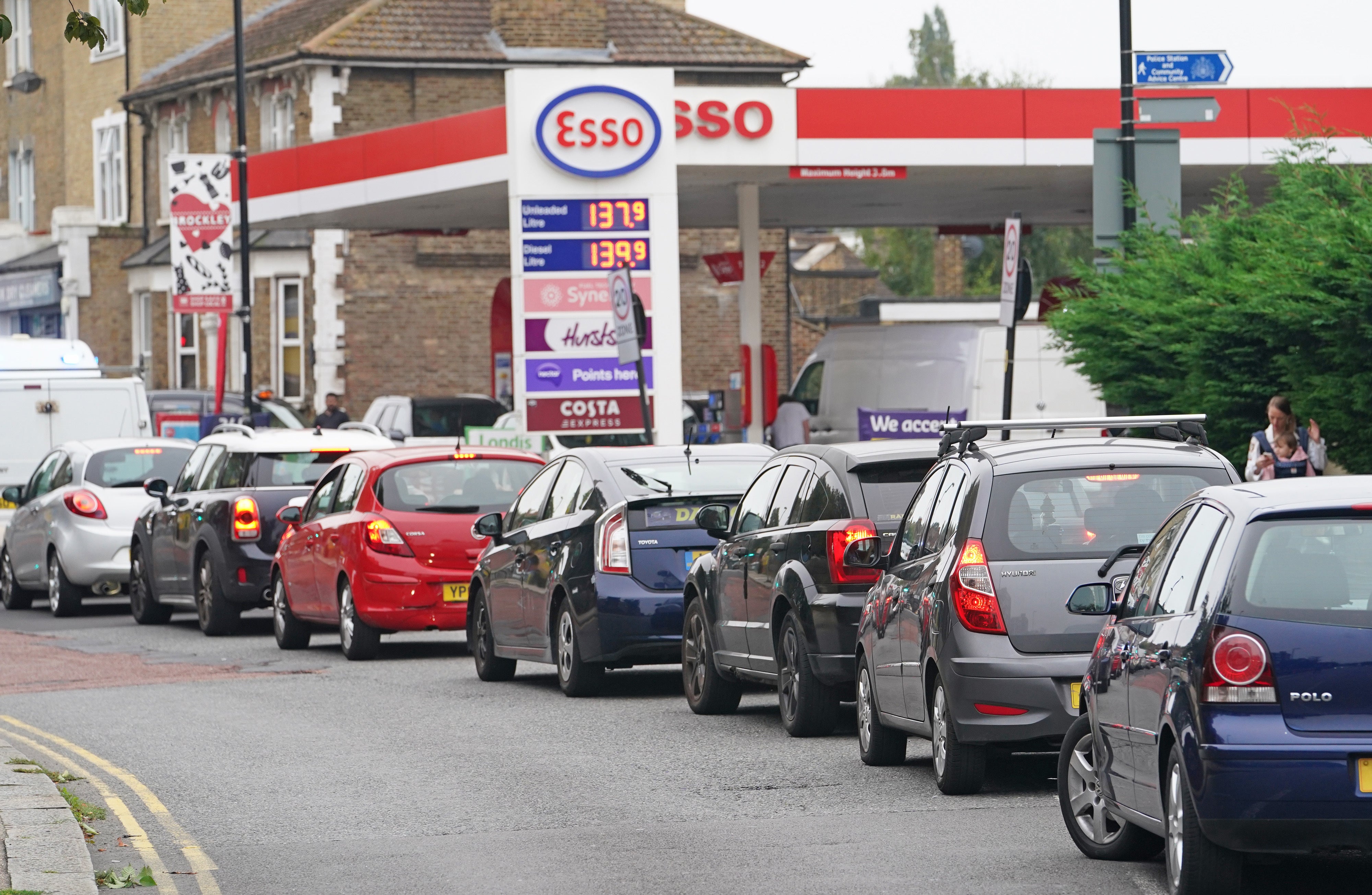 Motorists queue at an Esso petrol station in Brockley, south London (Dominic Lipinski/PA)