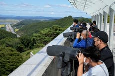 South Korea urges North to restore hotlines for any talks