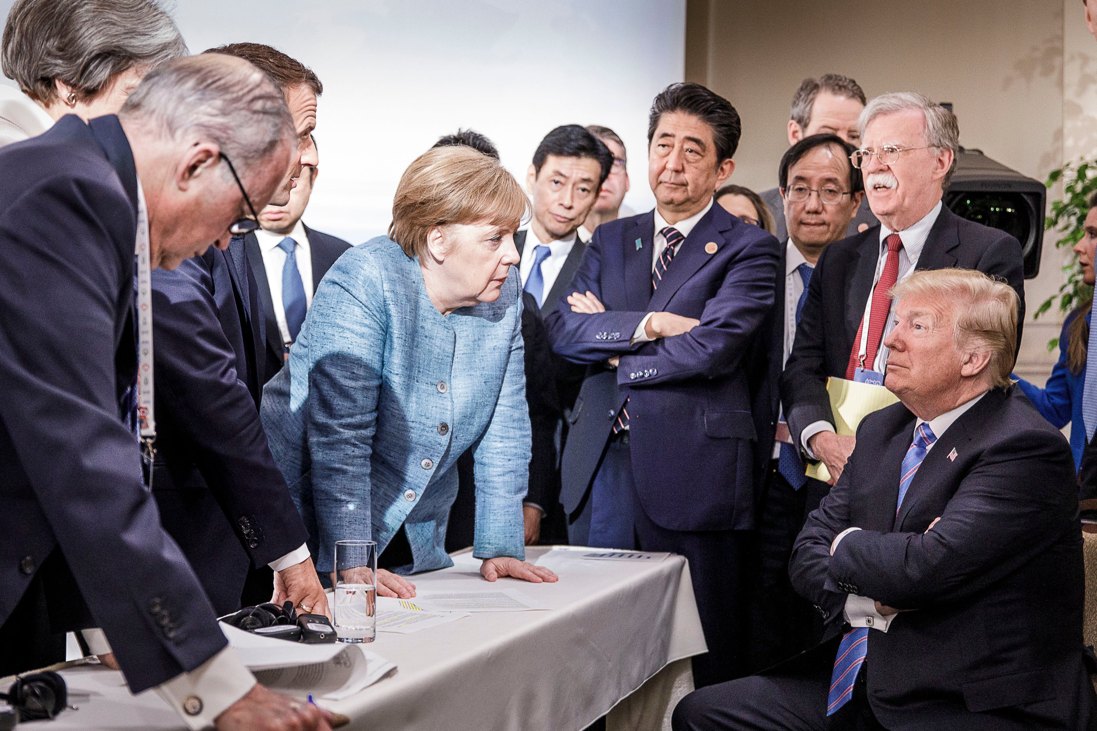 June 9, 2018: In this photo provided by the German Government Press Office, then German Chancellor Angela Merkel deliberates with US president Donald Trump on the sidelines of the official agenda on the second day of the G7 summit in Charlevoix, Canada