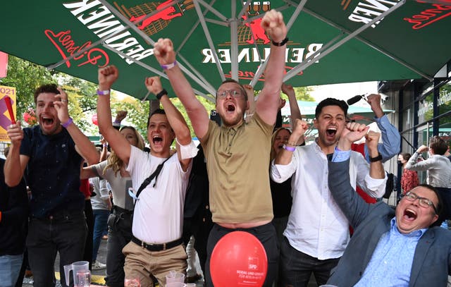 <p>Supporters of the SPD react to the first results of the federal election in front of Willy-Brandt-Haus, in Berlin</p>