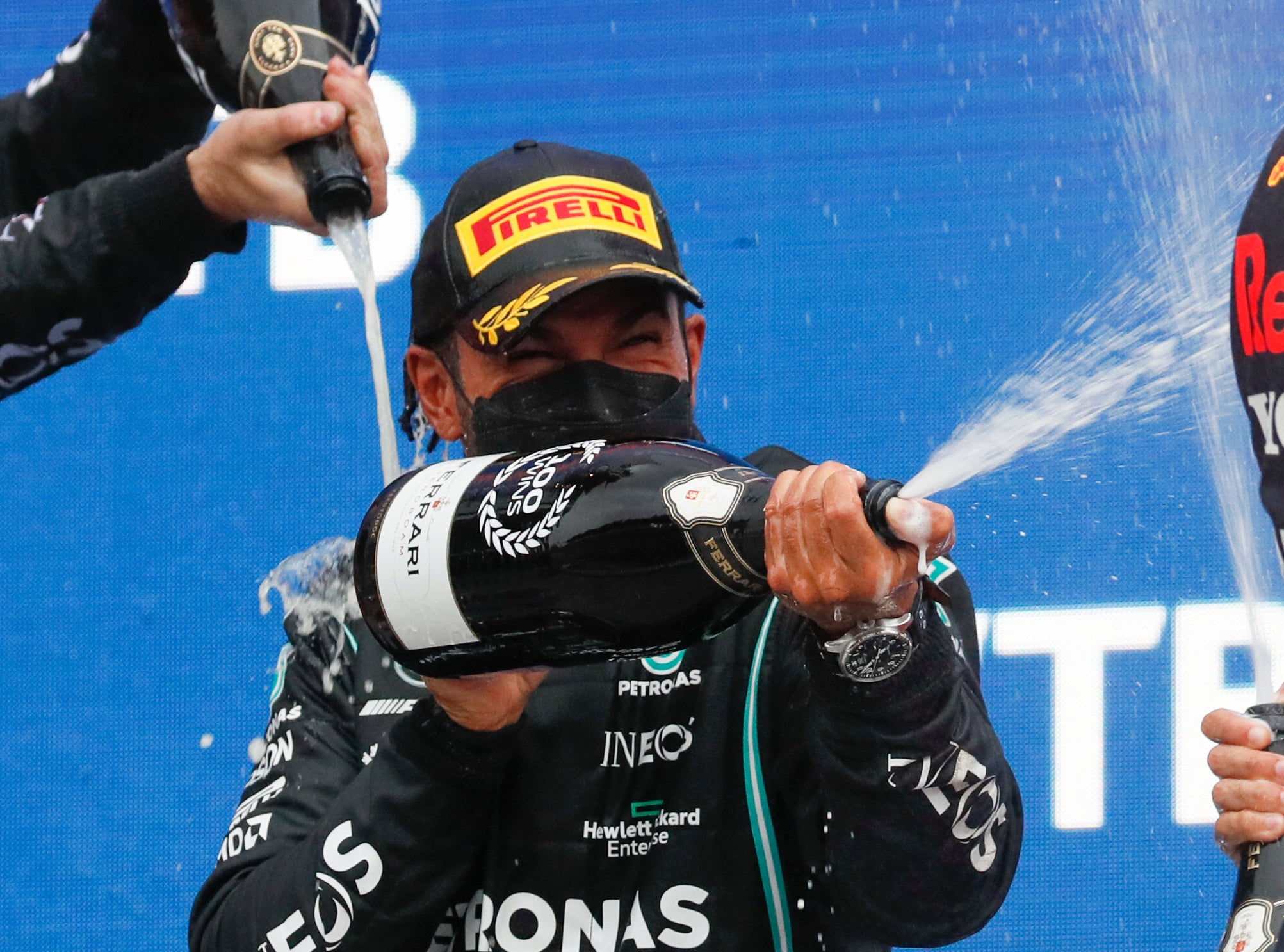 Hamilton celebrates on the podium (Yuri Kochetkov/AP)