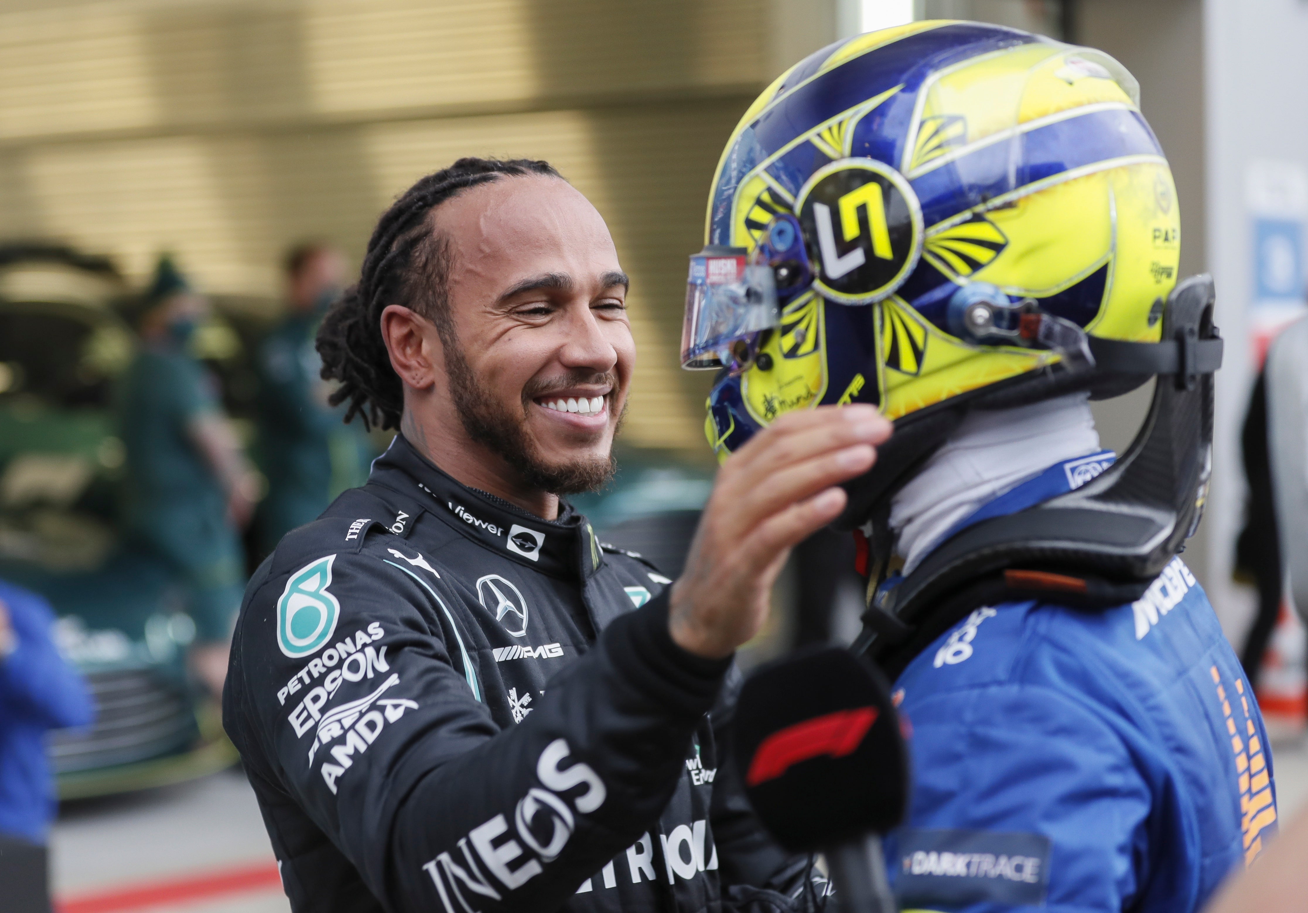 Lewis Hamilton is congratulated by Lando Norris